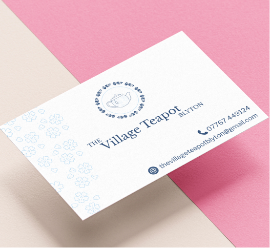 A business card mockup for The Village Teapot.